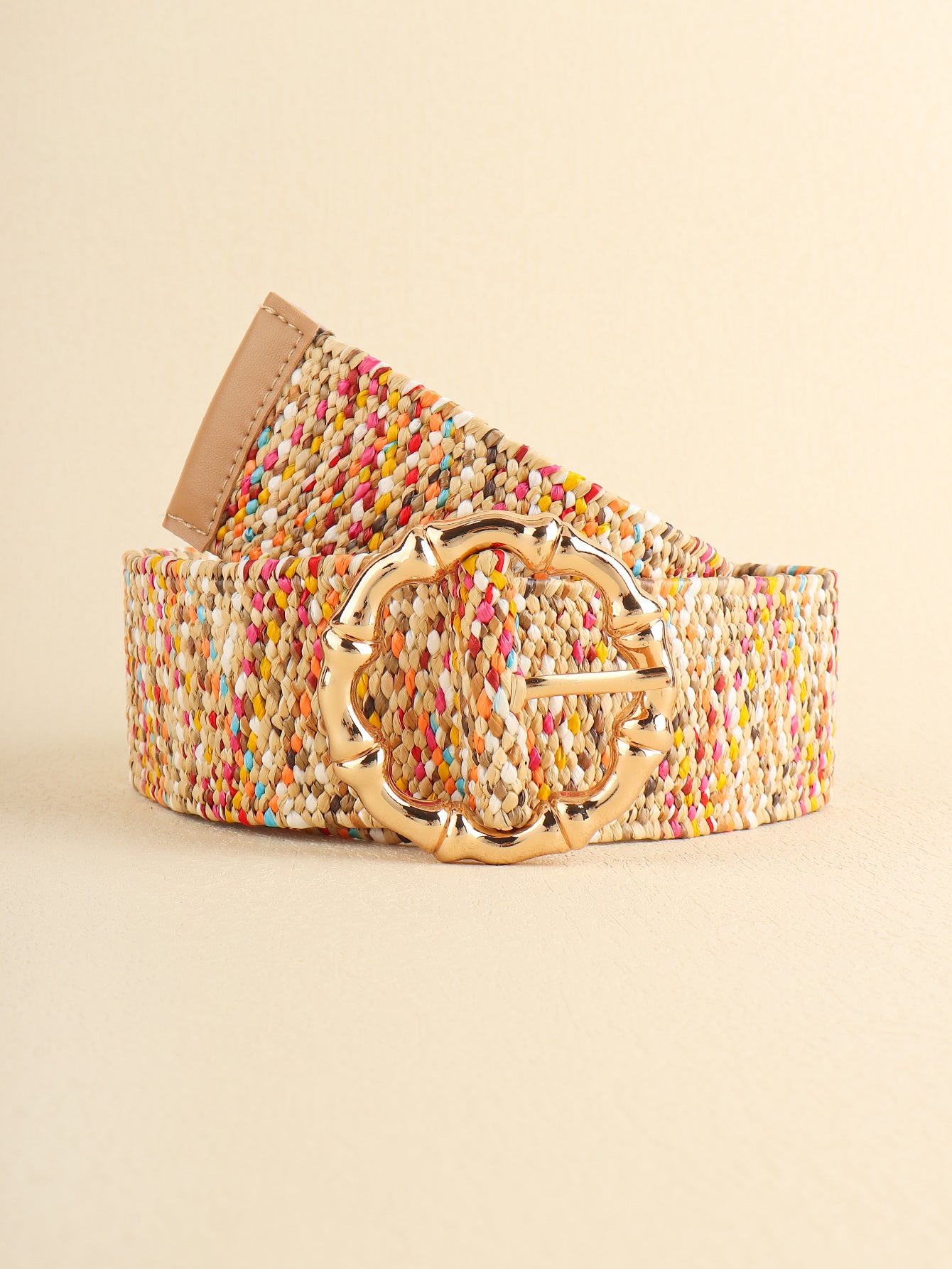 Multicolored wide belt, end and buckle close view with tan leather backing