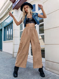 Camel wide-leg elastic waist pants with front pockets, relaxed drape.