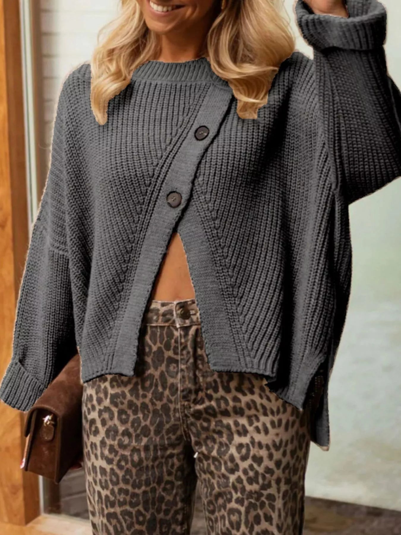 Asymmetrical button-detail knit sweater in gray with dark button front