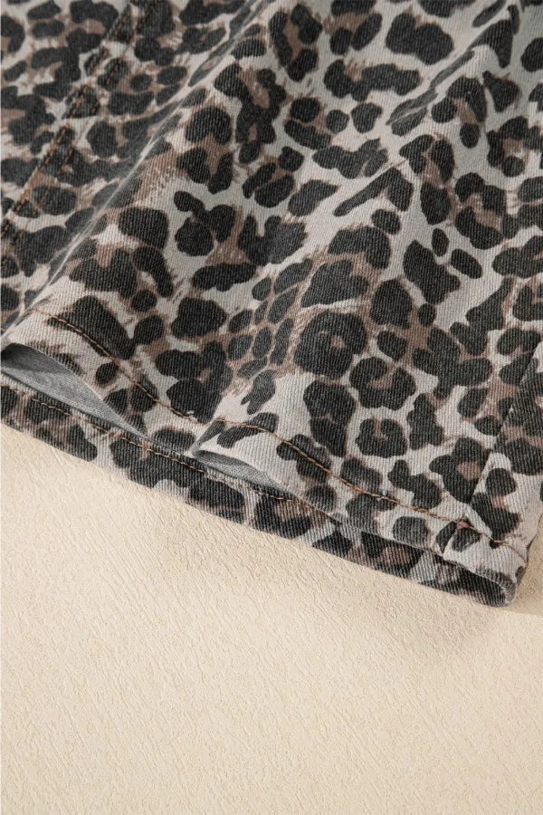 Leopard-print denim mini skirt hem with visible stitching and edging