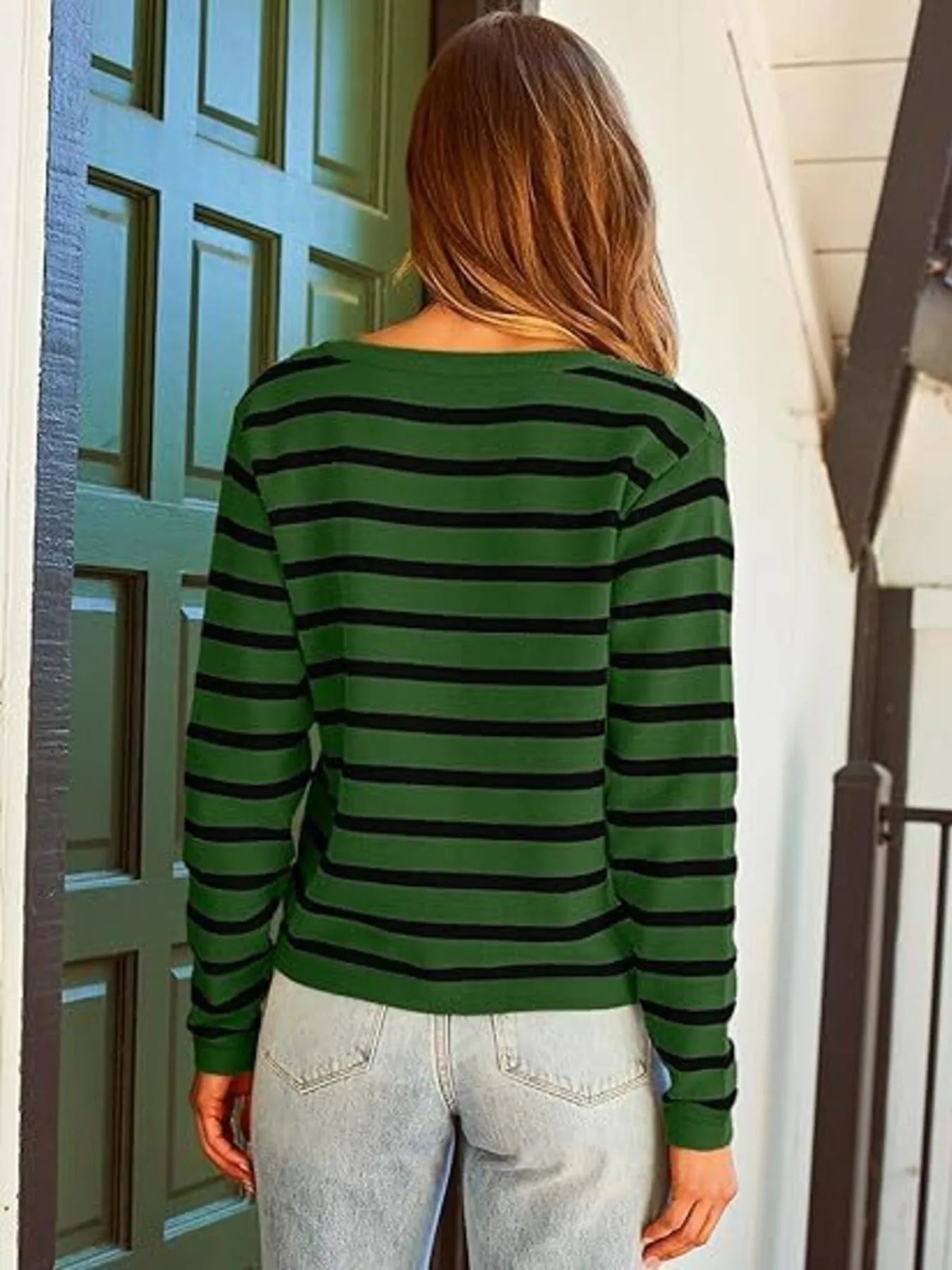 Green-and-black striped button-up cardigan with long sleeves and gold button placket