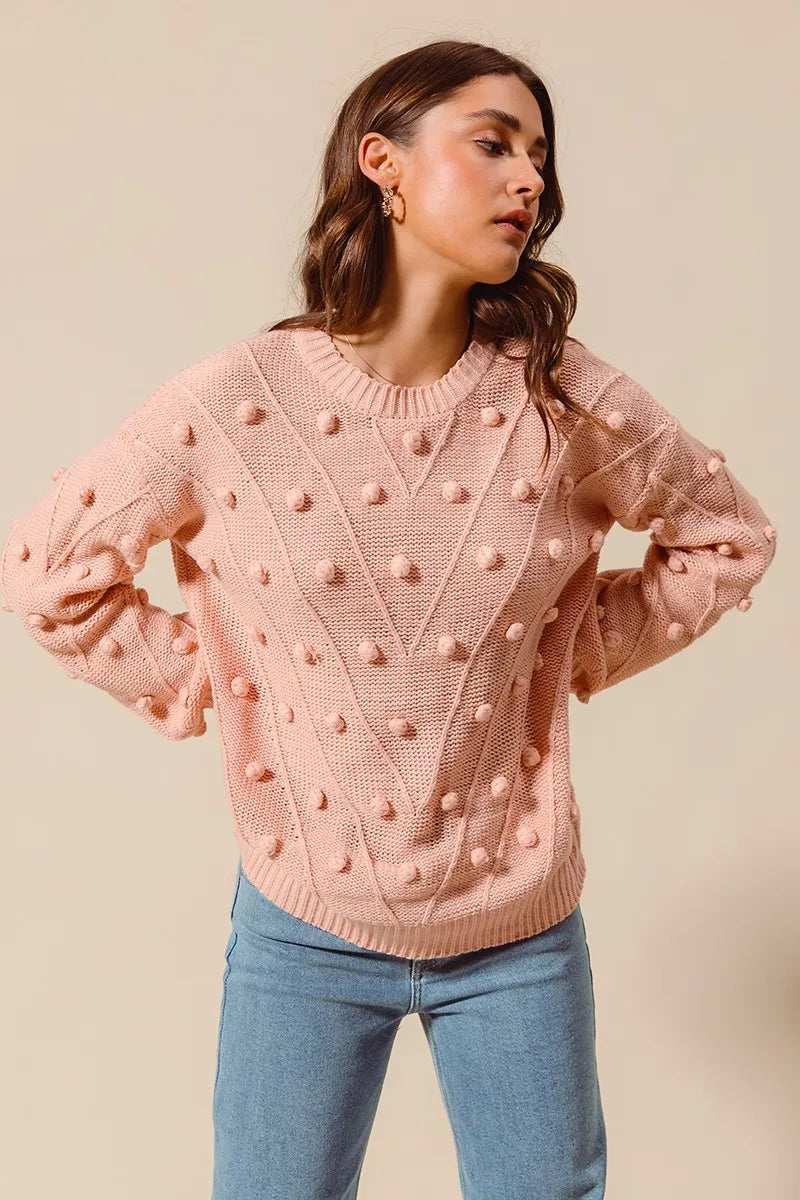 Blush pom-pom textured knit crewneck sweater with ribbed cuffs and hem