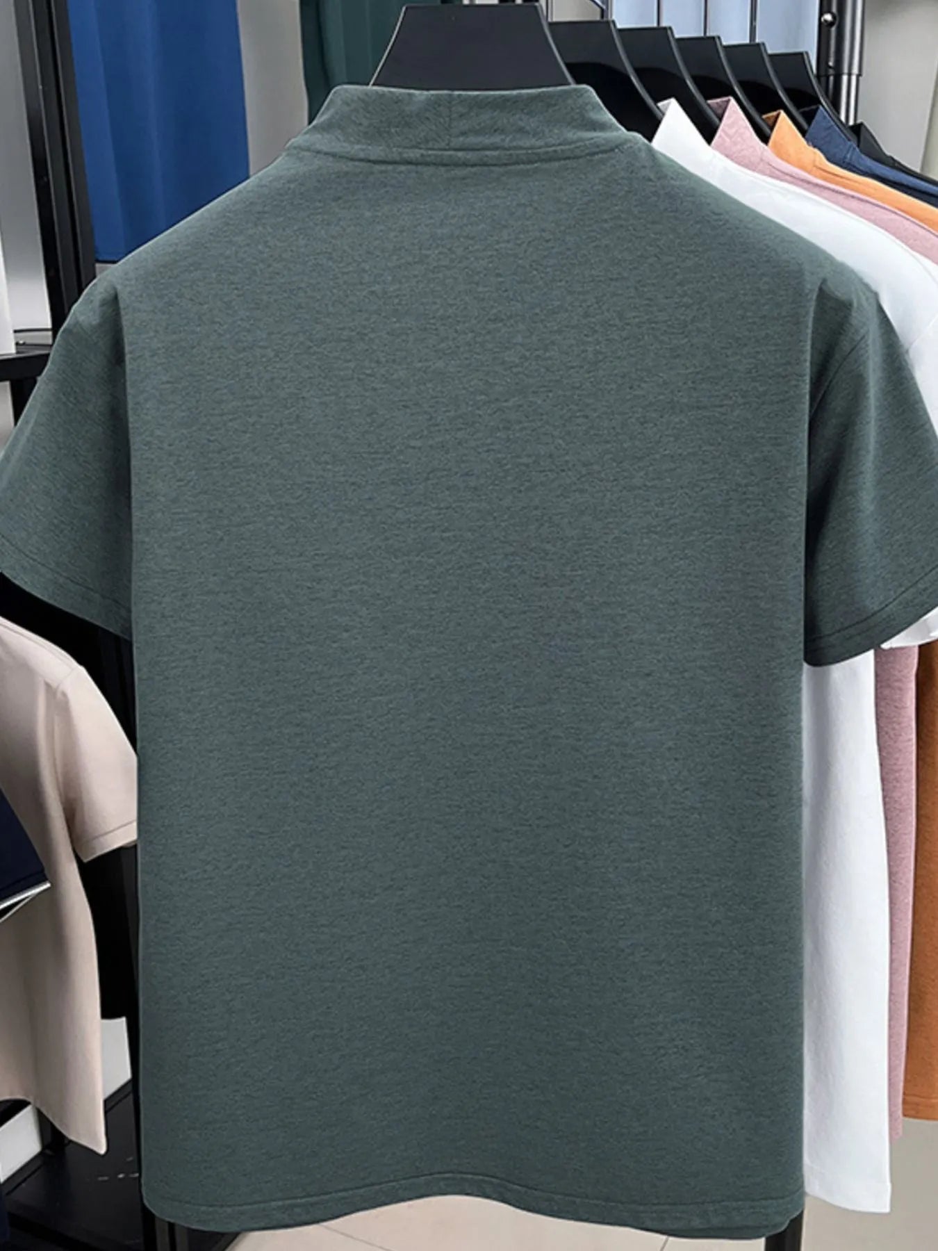 Men's quarter-zip short-sleeve top, heather green, back view