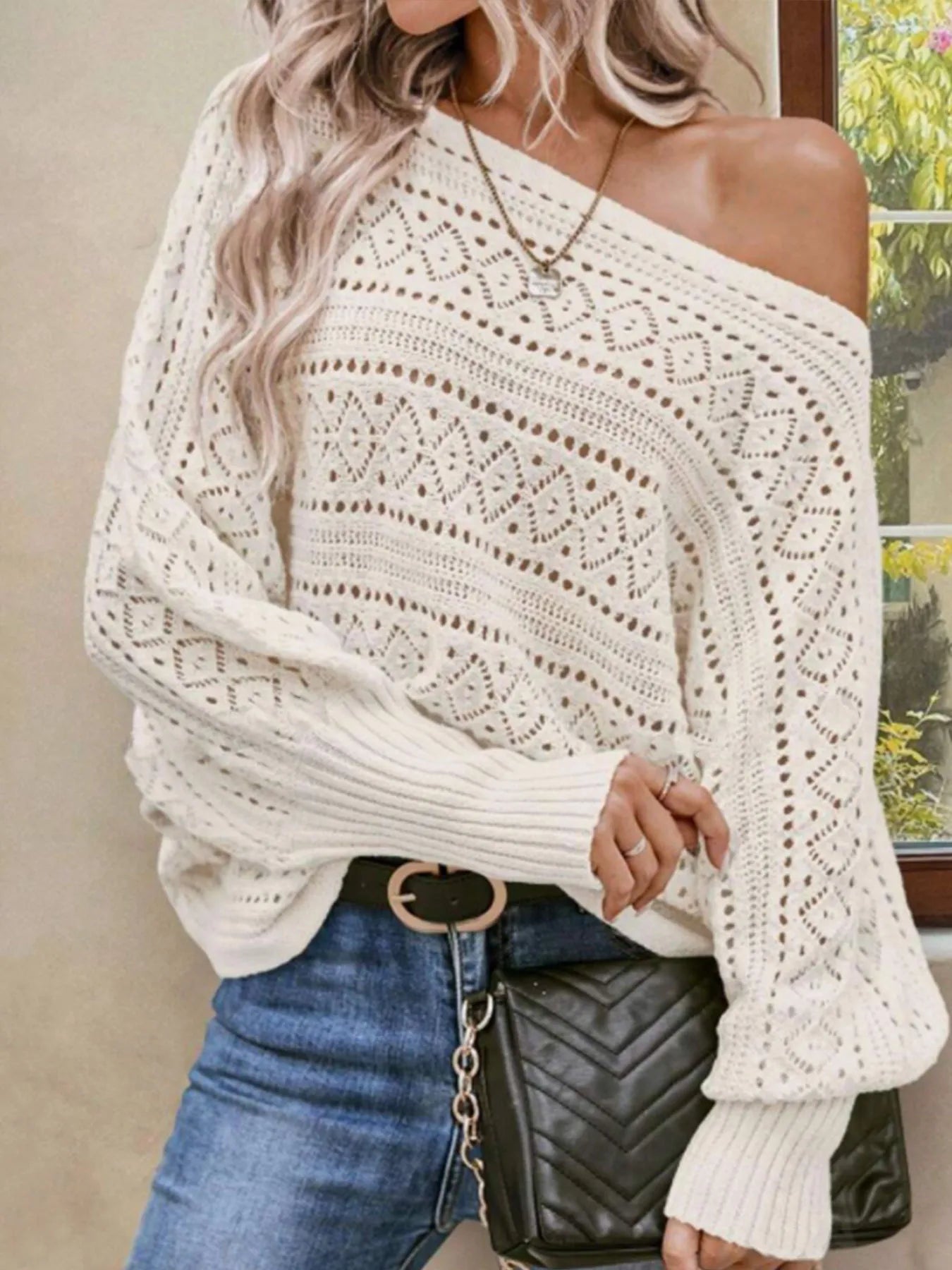 Beige openwork boat-neck sweater with draped shoulder and ribbed cuffs