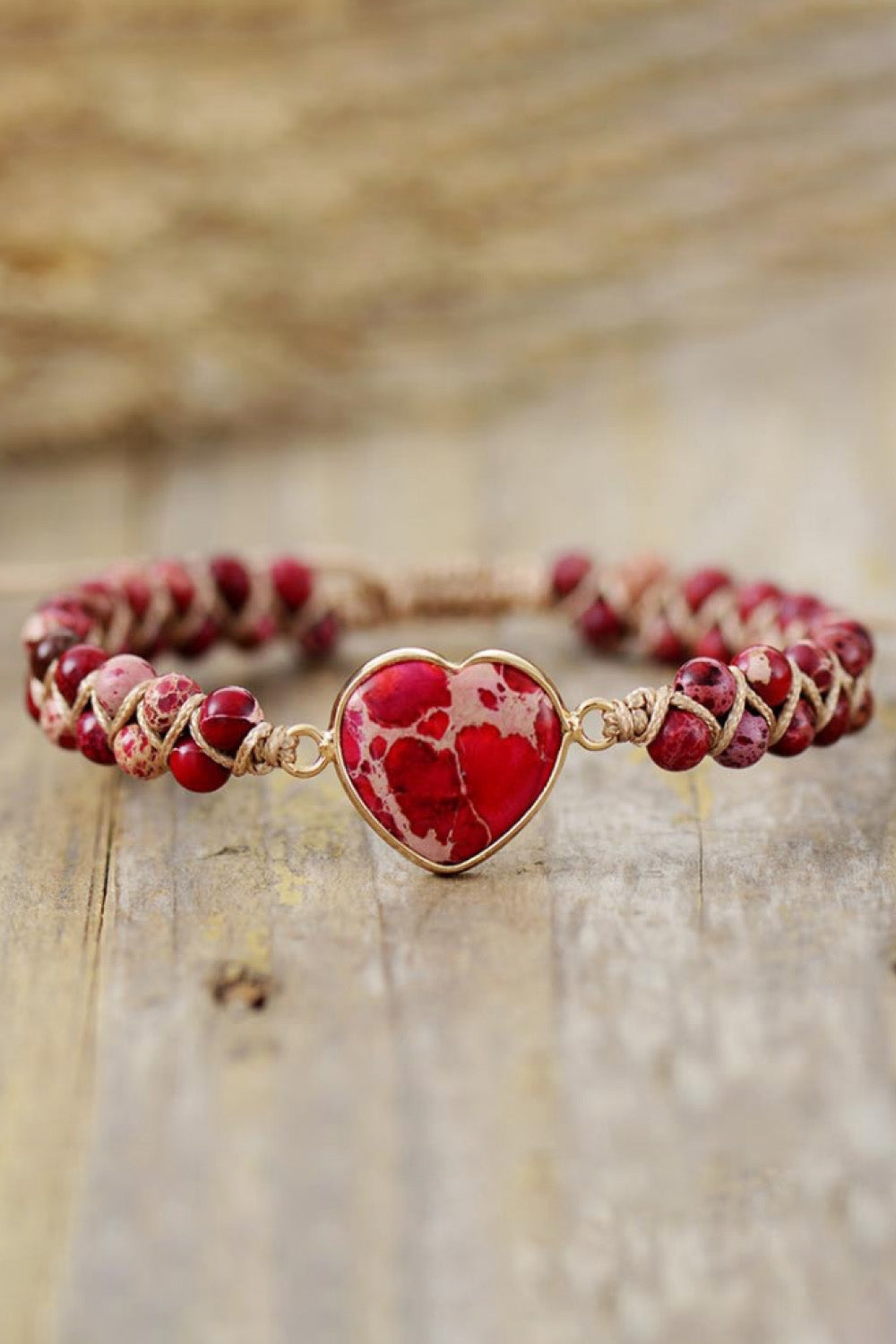 Red beaded heart bracelet with red heart cabochon pendant and gold-tone chain links