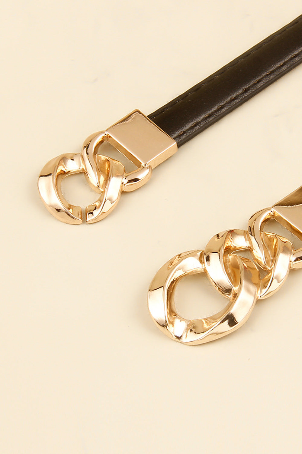 Skinny vegan leather belt with gold-tone chain-link buckle, dark brown strap