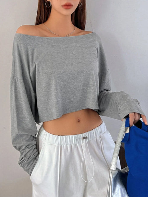 Gray boat-neck long sleeve top, loose cropped fit