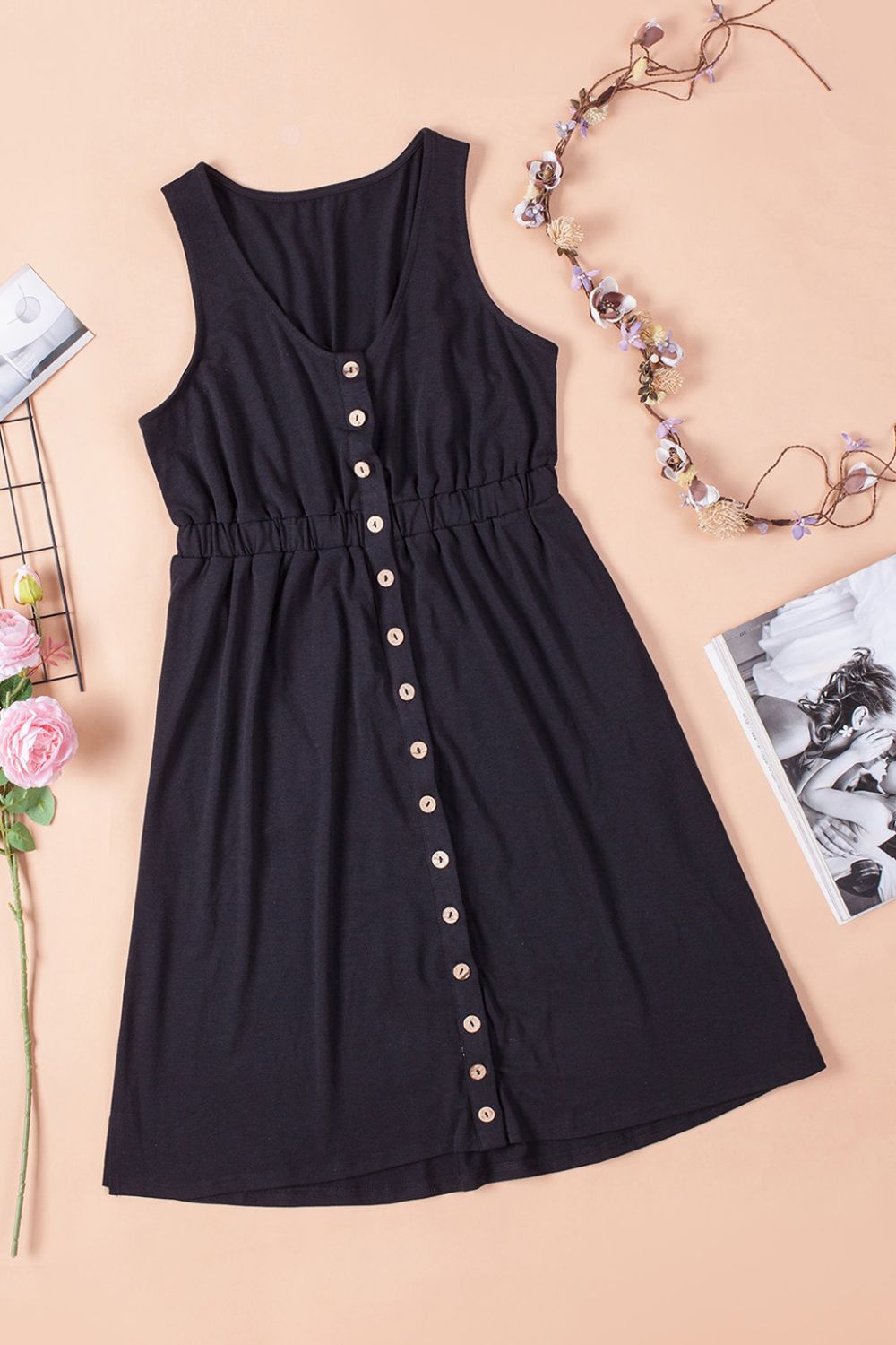 Sleeveless mini dress in dark navy with button front and elastic waist