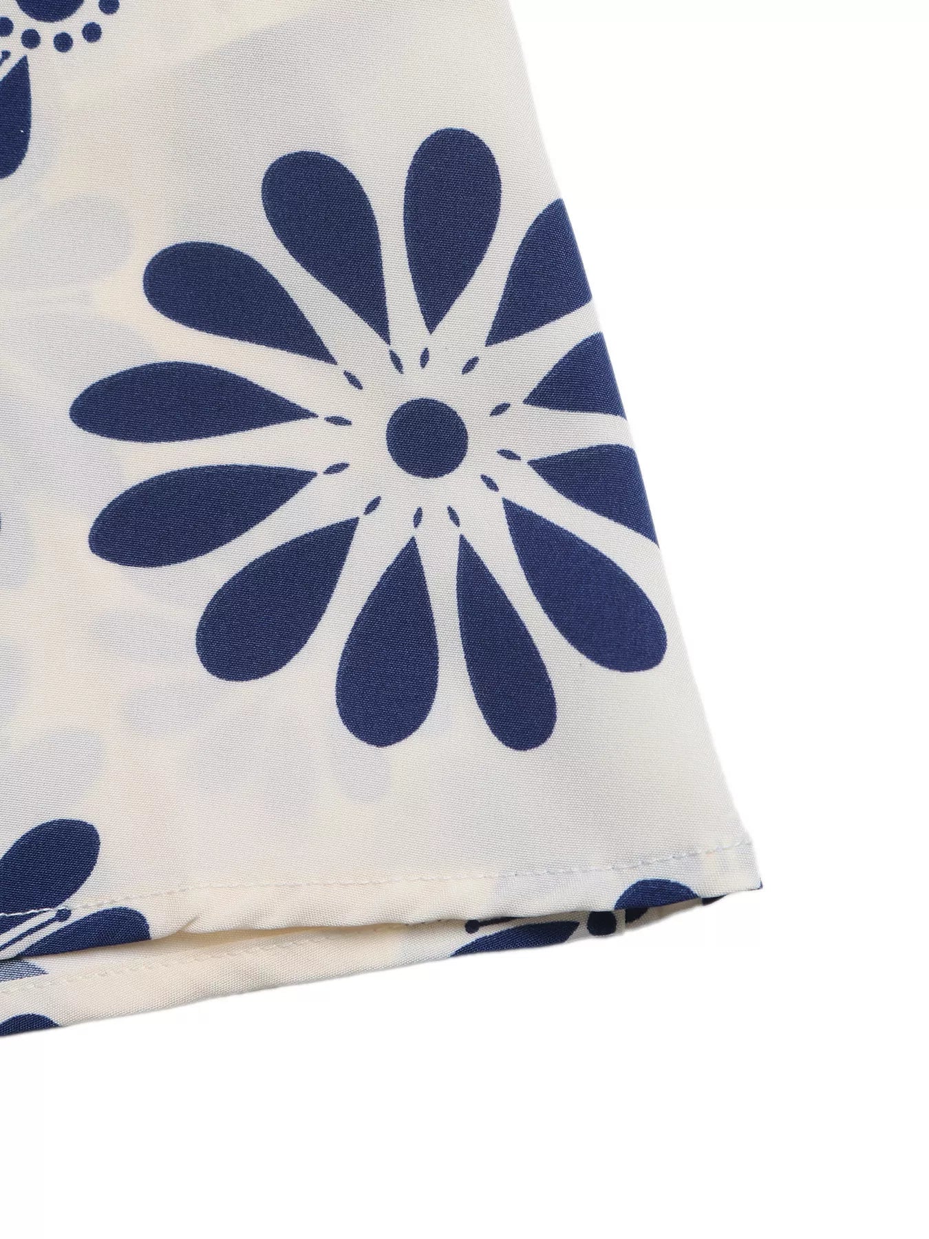 Cedar & Moore Floral Print Cutout Waist Maxi Dress on cream fabric with navy blue flowers
