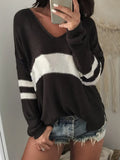 Black V-neck long-sleeve sweater with wide cream stripe and ribbed cuffs