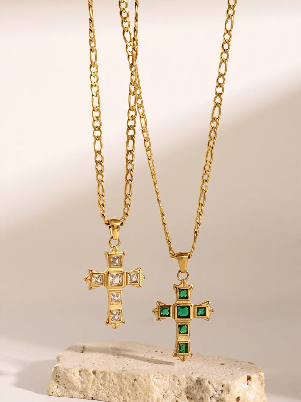 Gold-tone cross pendant necklace with square clear stones and green center accents
