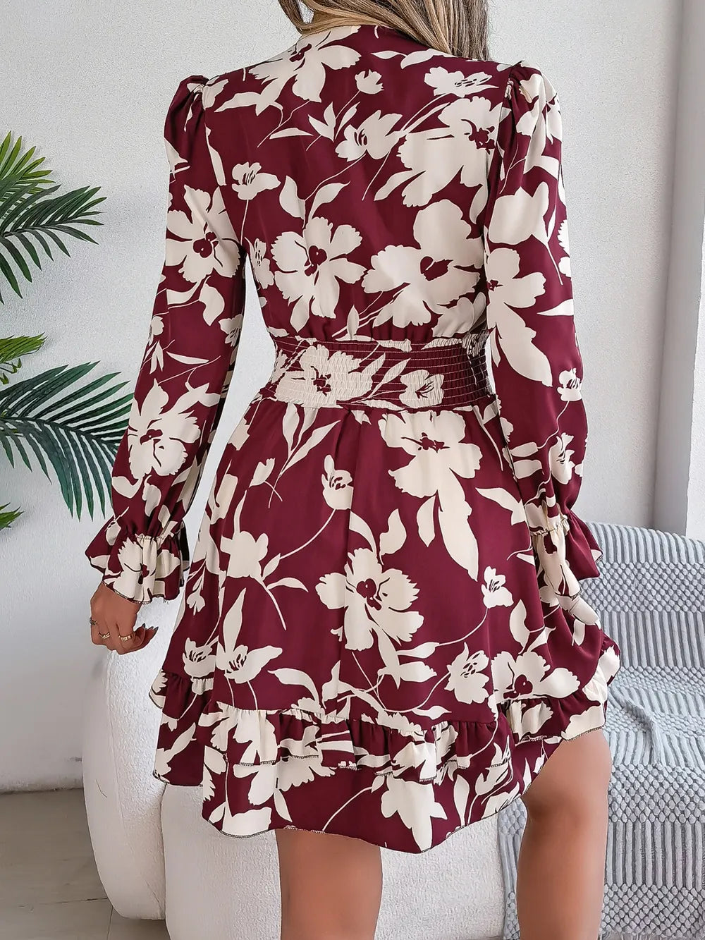Burgundy floral long-sleeve dress with tied front and ruffled tiered back