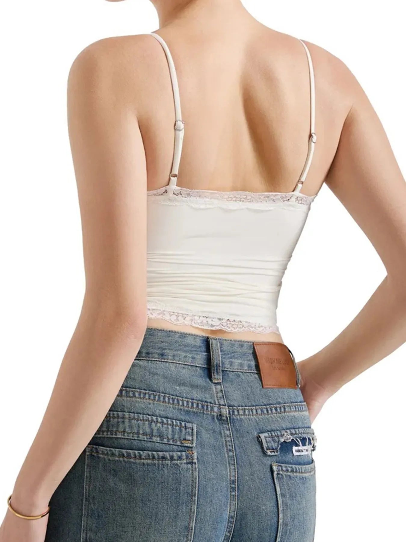 White lace-trim cami top with spaghetti straps and scalloped lace waist hem