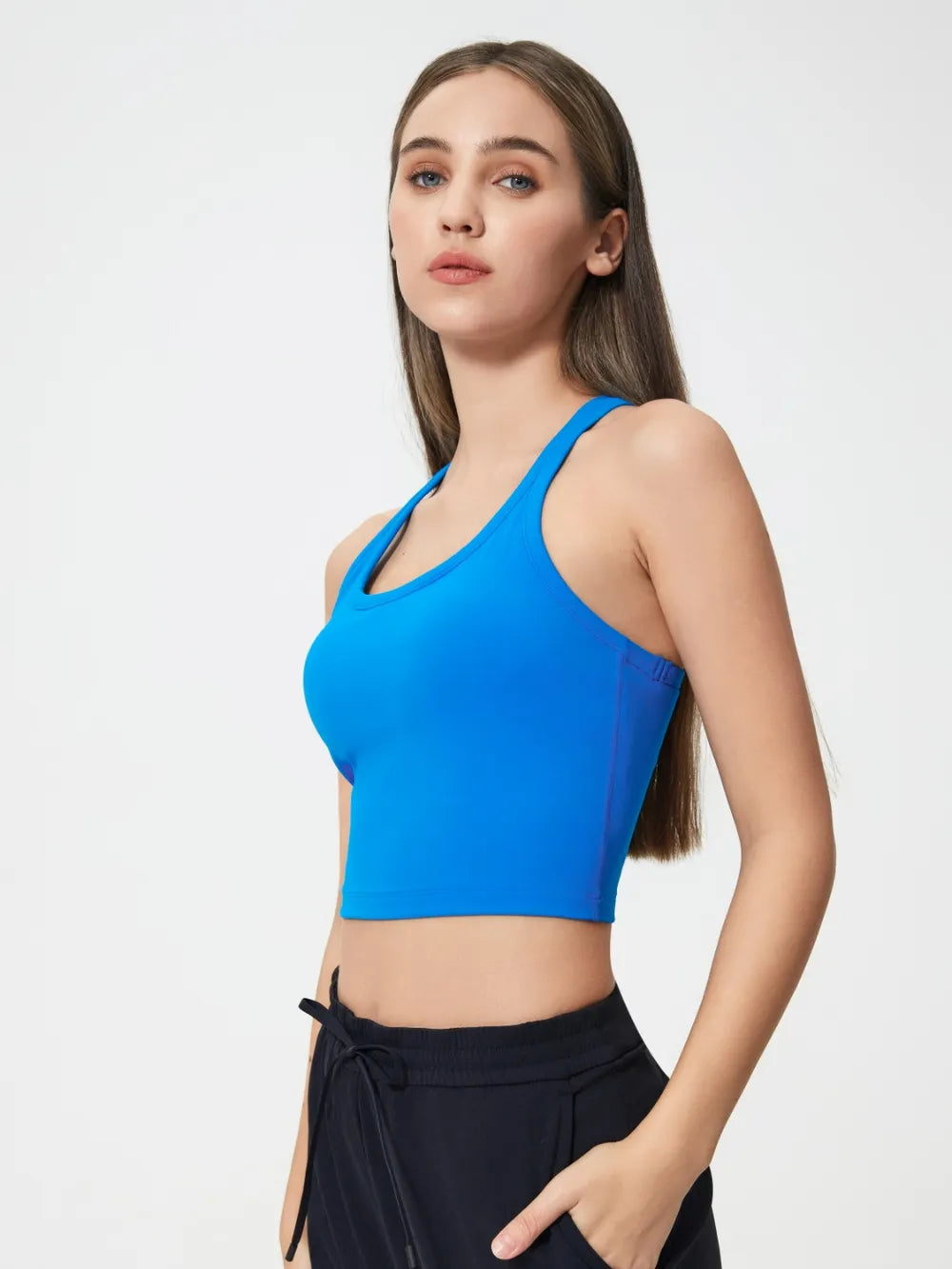 Royal blue scoop neck active tank with racerback and smooth, stretchy fabric.