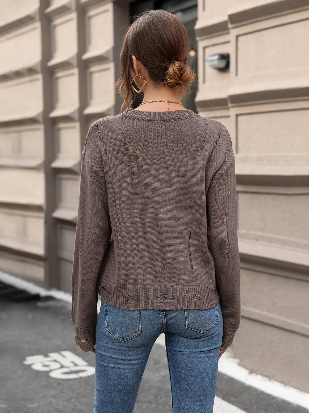 Back view of coffee brown long-sleeve sweater with knit yoke and ribbed hem