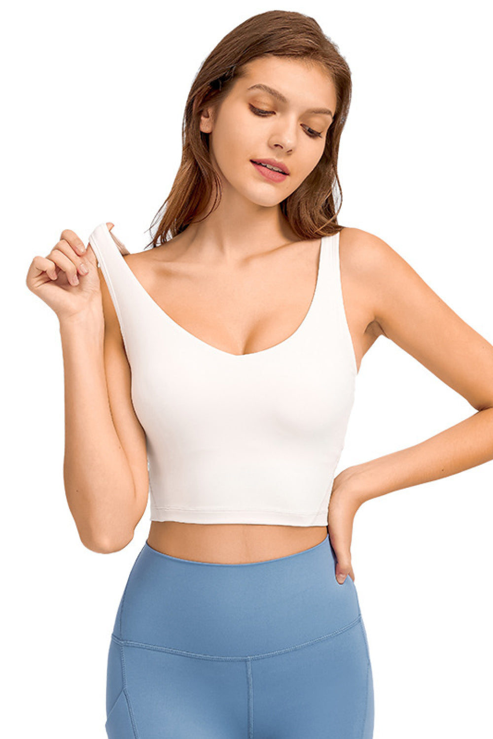 White deep V-neck crop sports bra with wide straps
