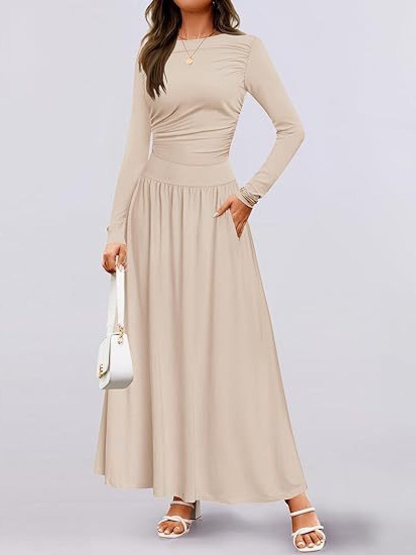 Long sleeve maxi dress in beige with long sleeves and gathered skirt, front view