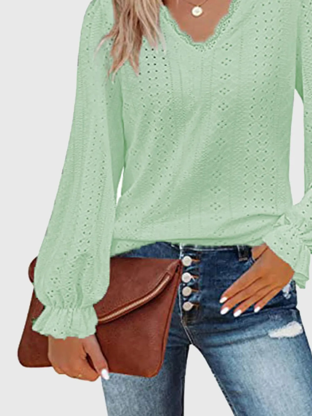 Mint green eyelet V-neck blouse with long sleeves and flounce cuff detail