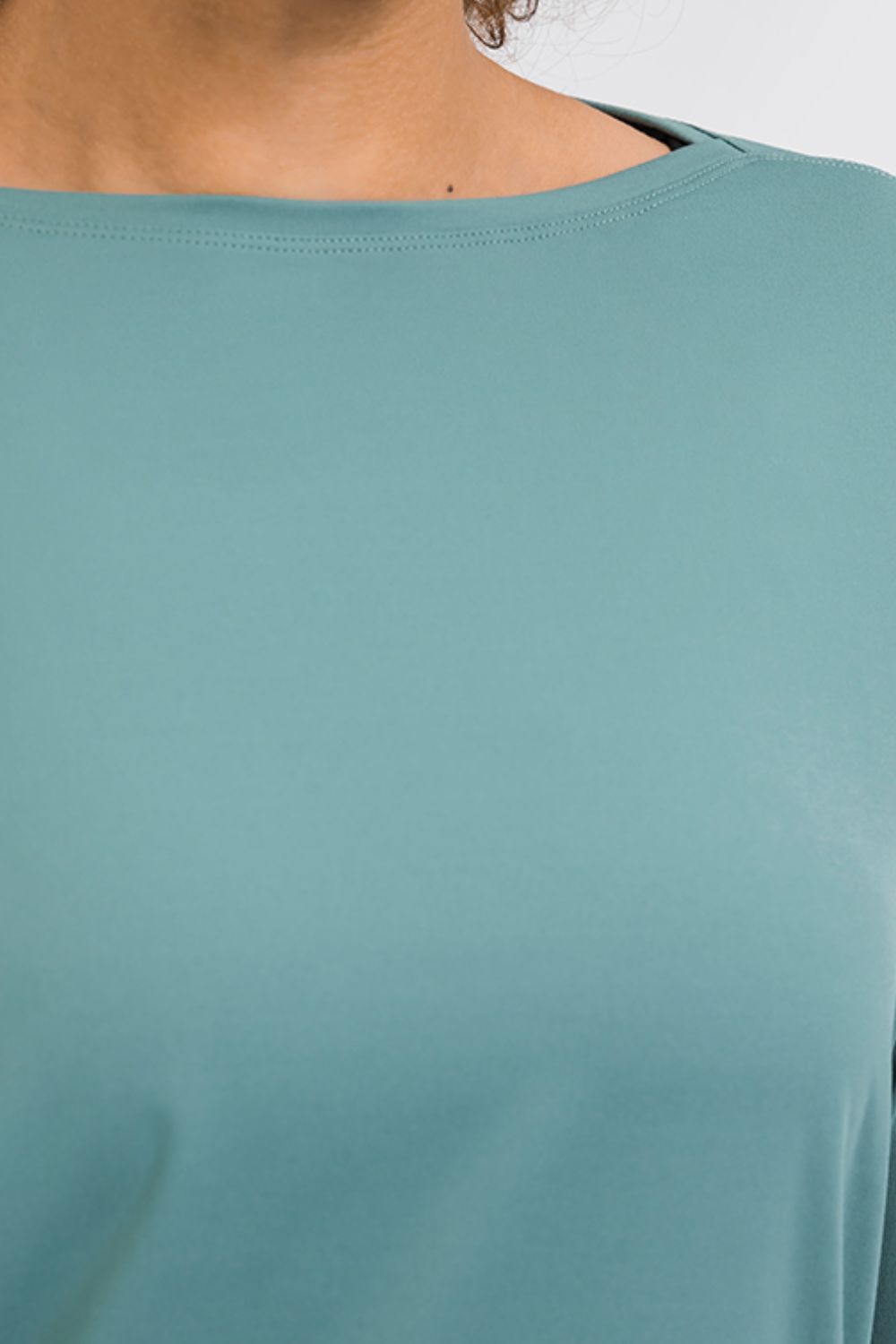Teal loose fit active top, crew neckline and smooth front