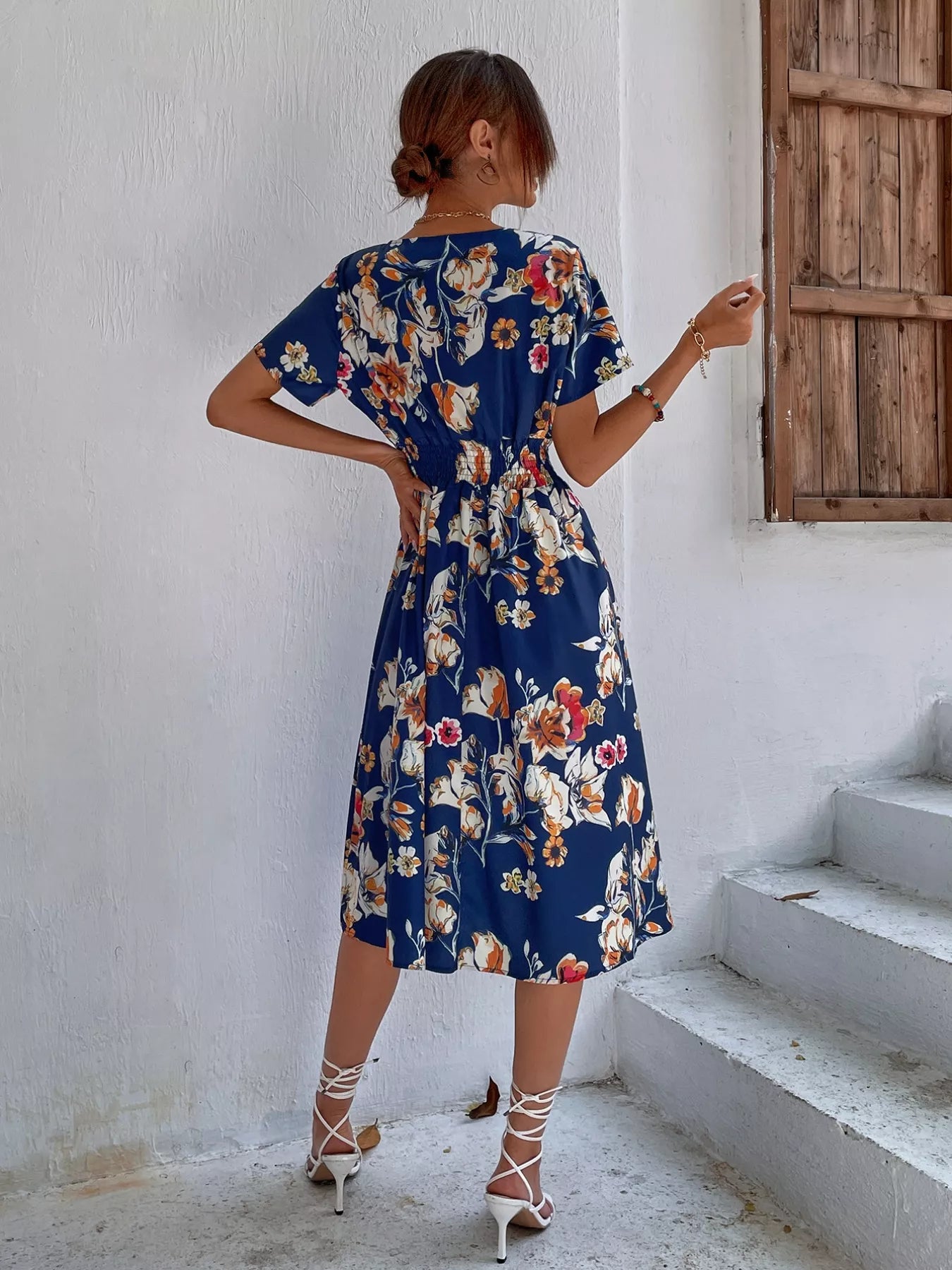 Floral short-sleeve midi dress in dark blue with white, pink, and red flower print