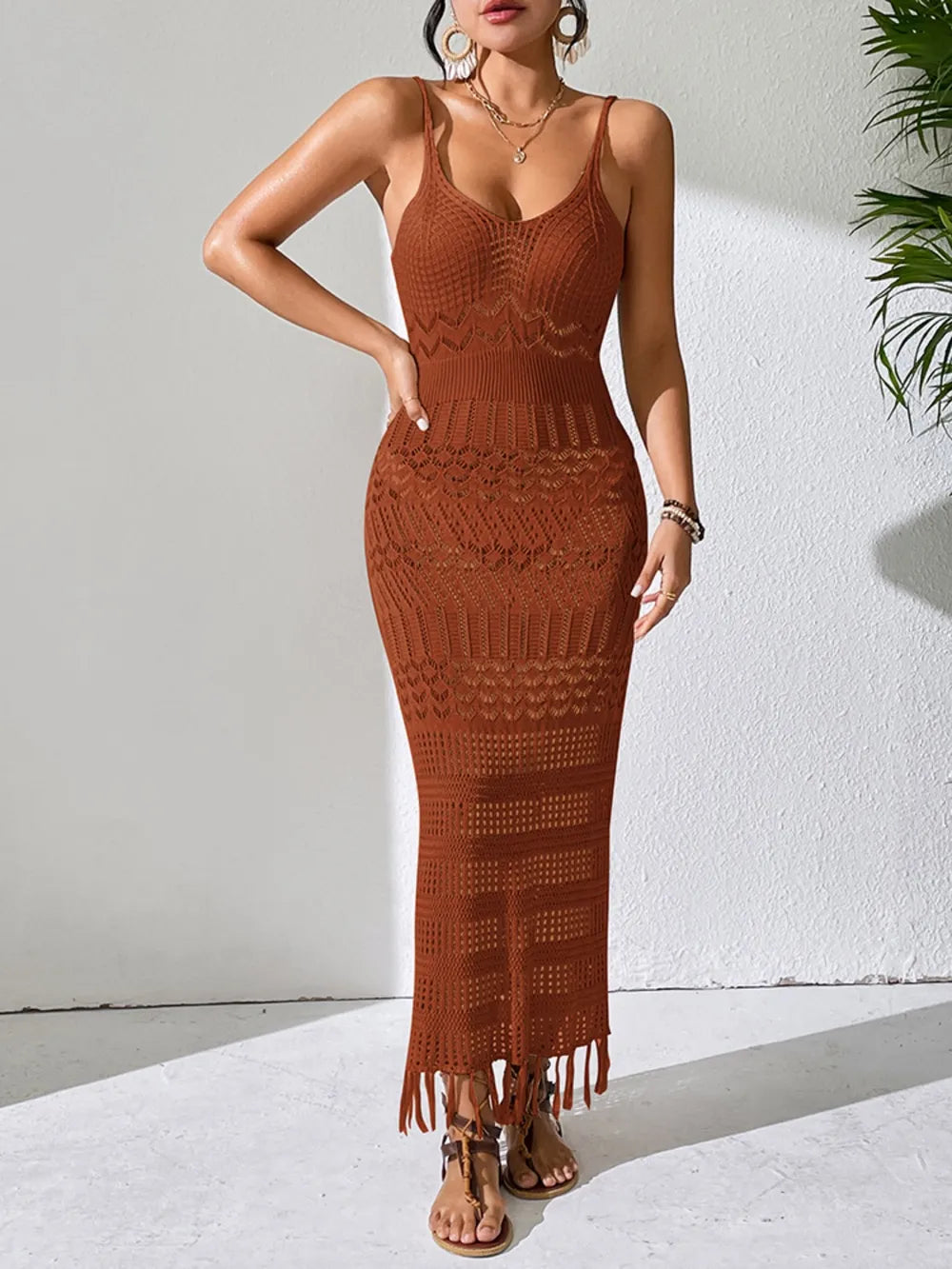 Openwork scoop neck cover-up dress in rust orange, sleeveless crochet with fringe hem.