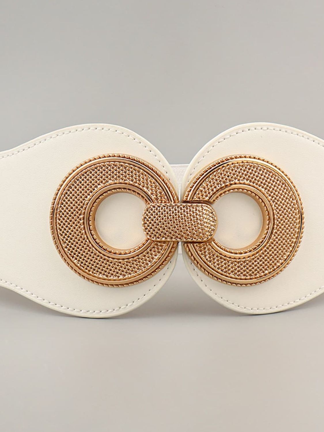 Elastic vegan belt with ring buckle detail, cream strap and caramel rings
