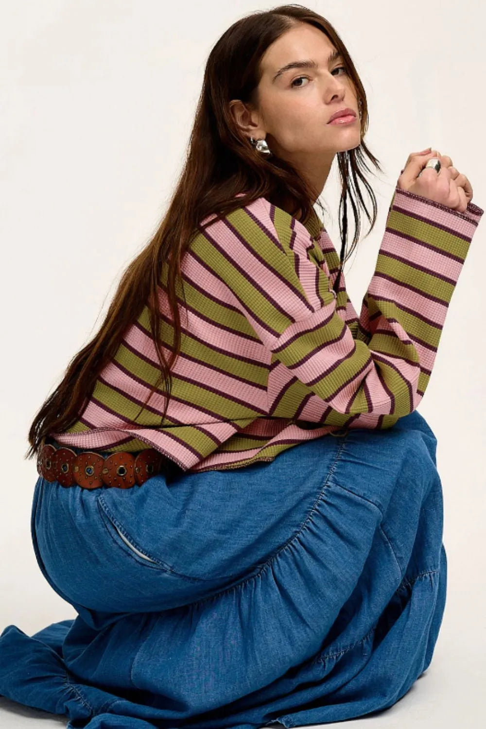 Striped long-sleeve T-shirt with notched neckline, pink and green and purple stripes, side view