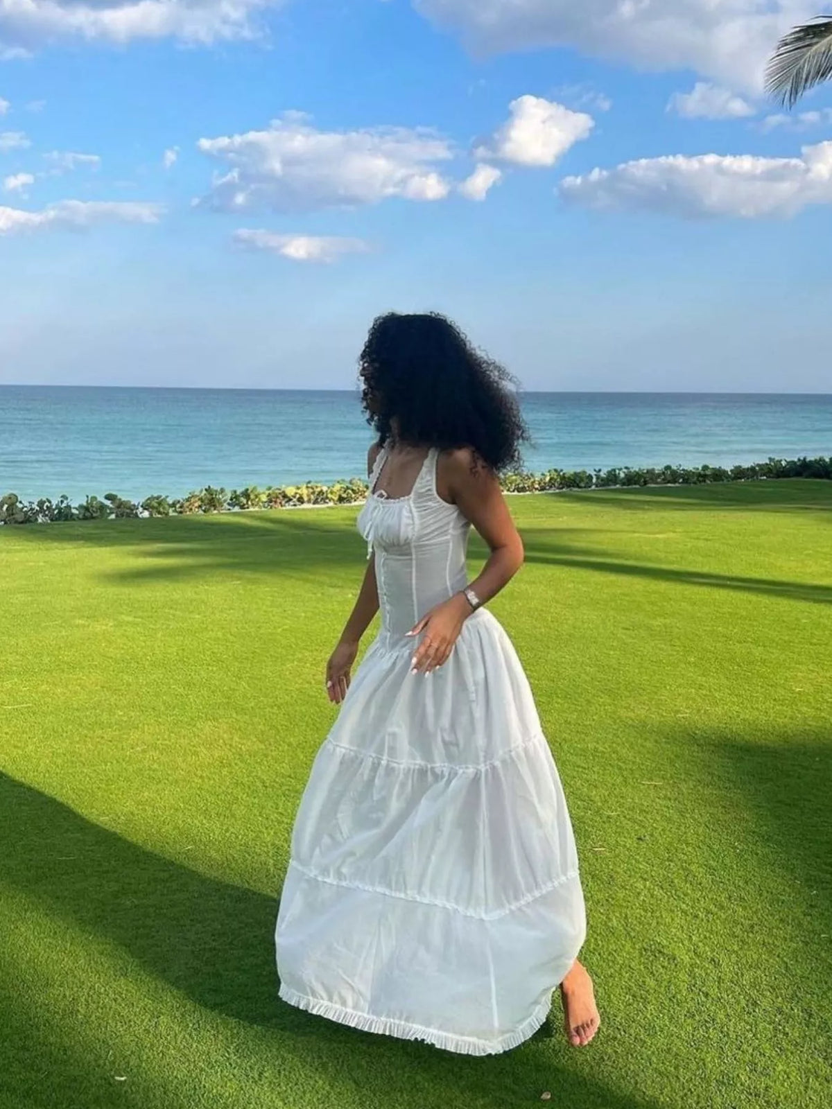 White cotton tiered maxi dress with smocked back bodice and ruffled hem layers