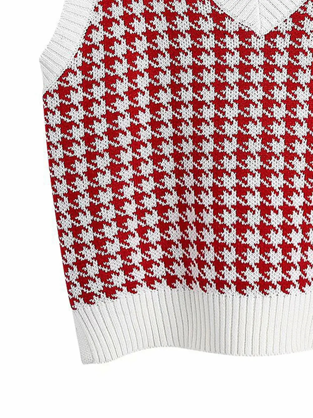 Red-and-white houndstooth sweater vest knit with ribbed hem