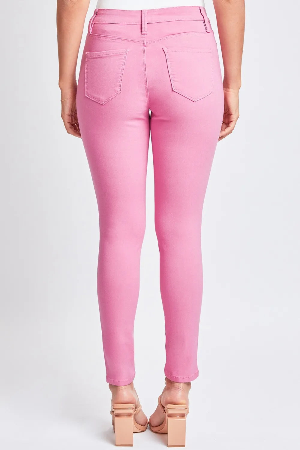 Hyperstretch mid-rise skinny pants in pink with front pockets and belt loops