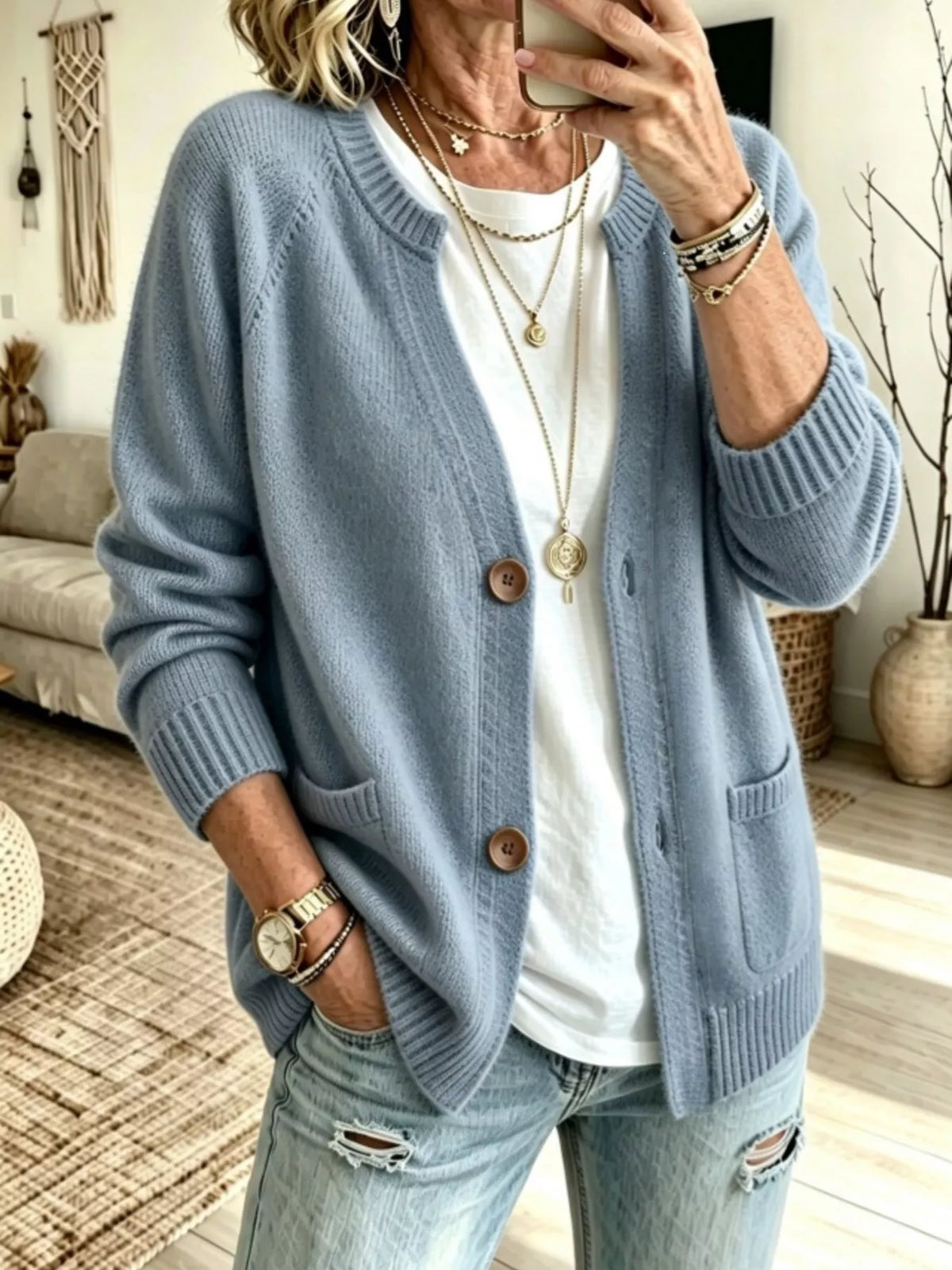 Sky blue button-up cardigan with raglan sleeves, ribbed cuffs, and patch pockets