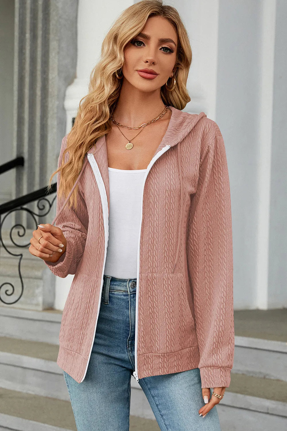 Dusty pink zip-up hoodie with drawstring hood and front zipper, long sleeves