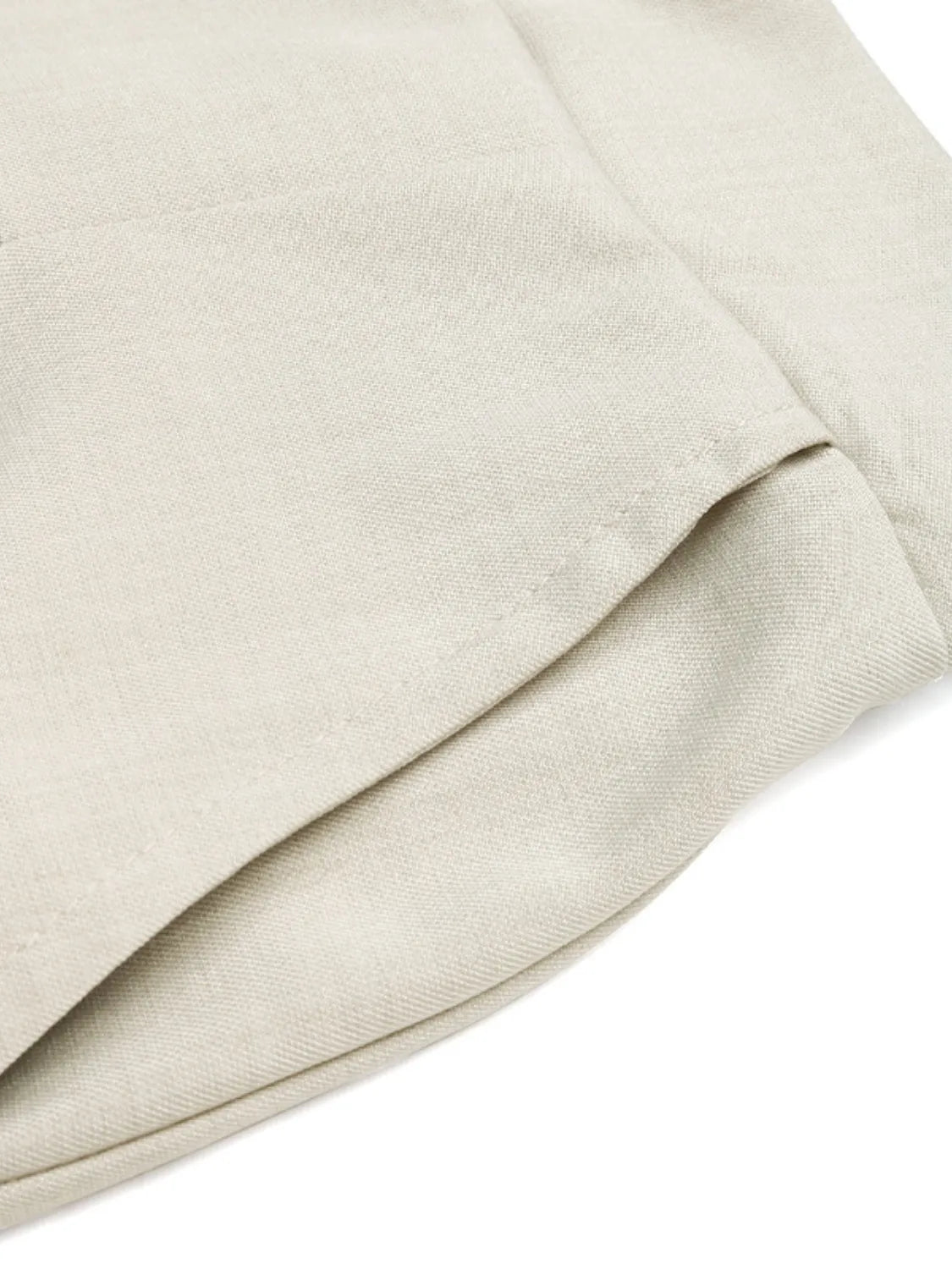 Beige woven fabric panel from wide-leg pleated pants