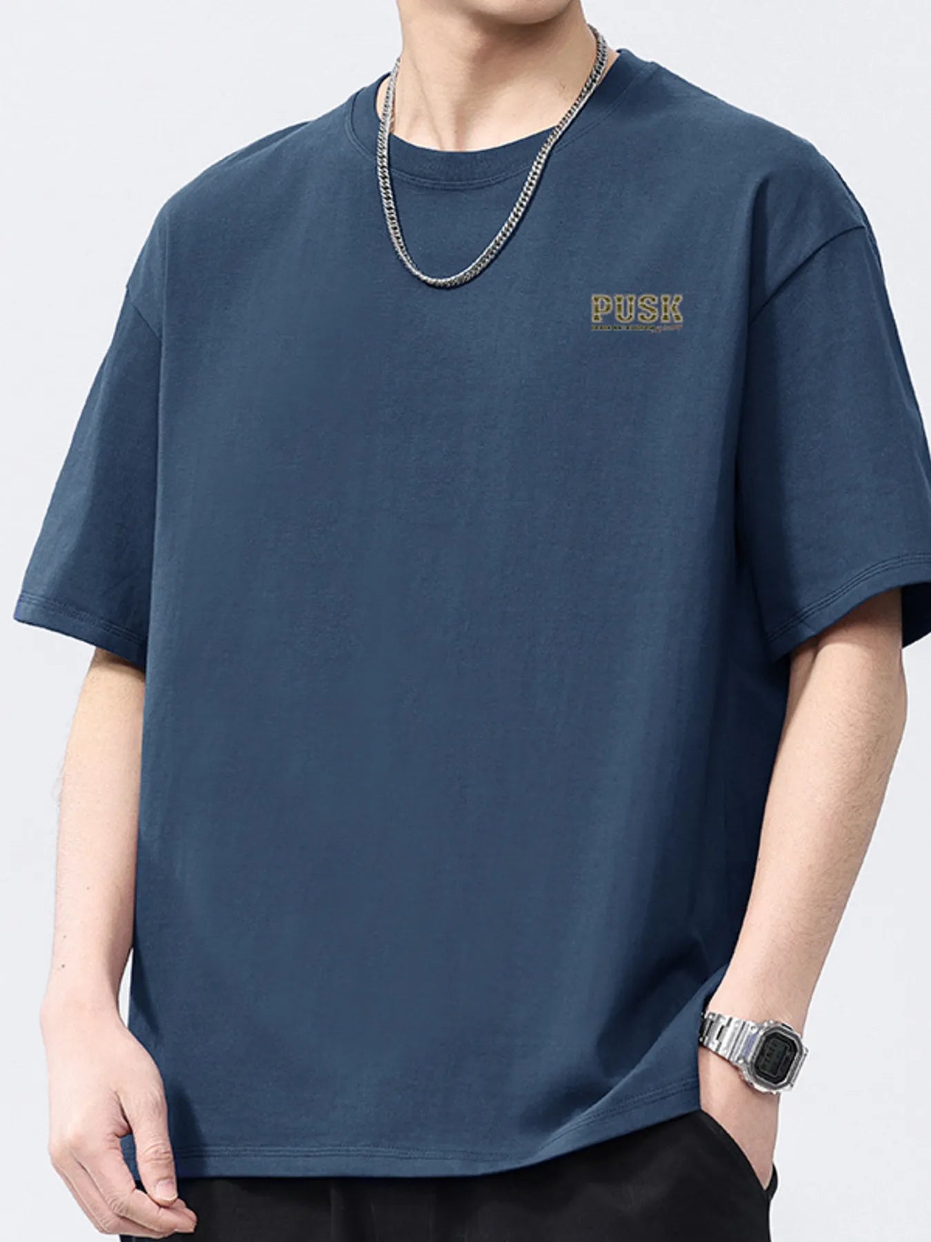 Navy blue men's short-sleeve crewneck T-shirt with small chest logo.