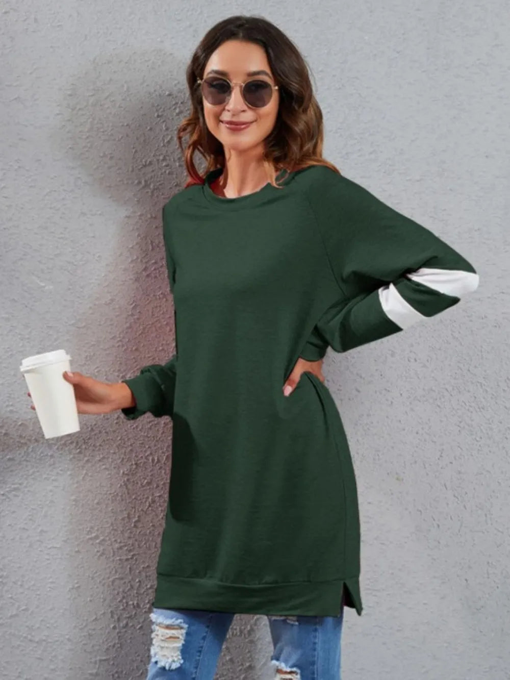 Dark green long-sleeve T-shirt with round neck and white striped cuffs