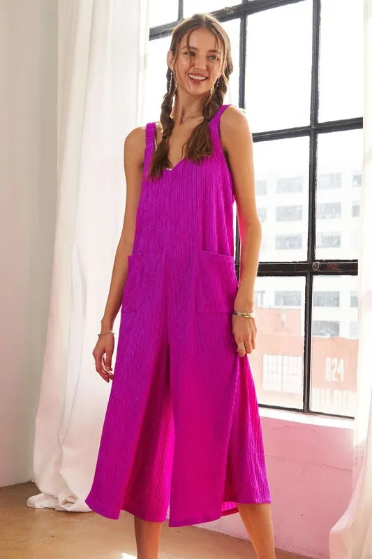 Cerise textured wide-leg jumpsuit, sleeveless with flowing wide legs