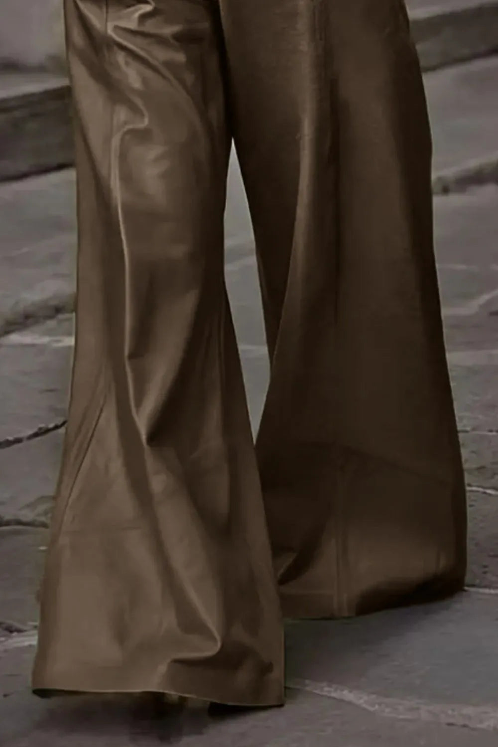 Taupe-brown wide flare pant legs with smooth drape and stitched seams