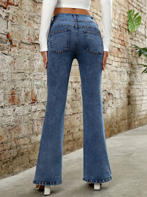 Medium blue bootcut jeans with back yoke and back pockets, flared leg hem