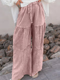 Dusty pink mineral-wash tiered wide-leg pants with drawstring waist and patch pockets