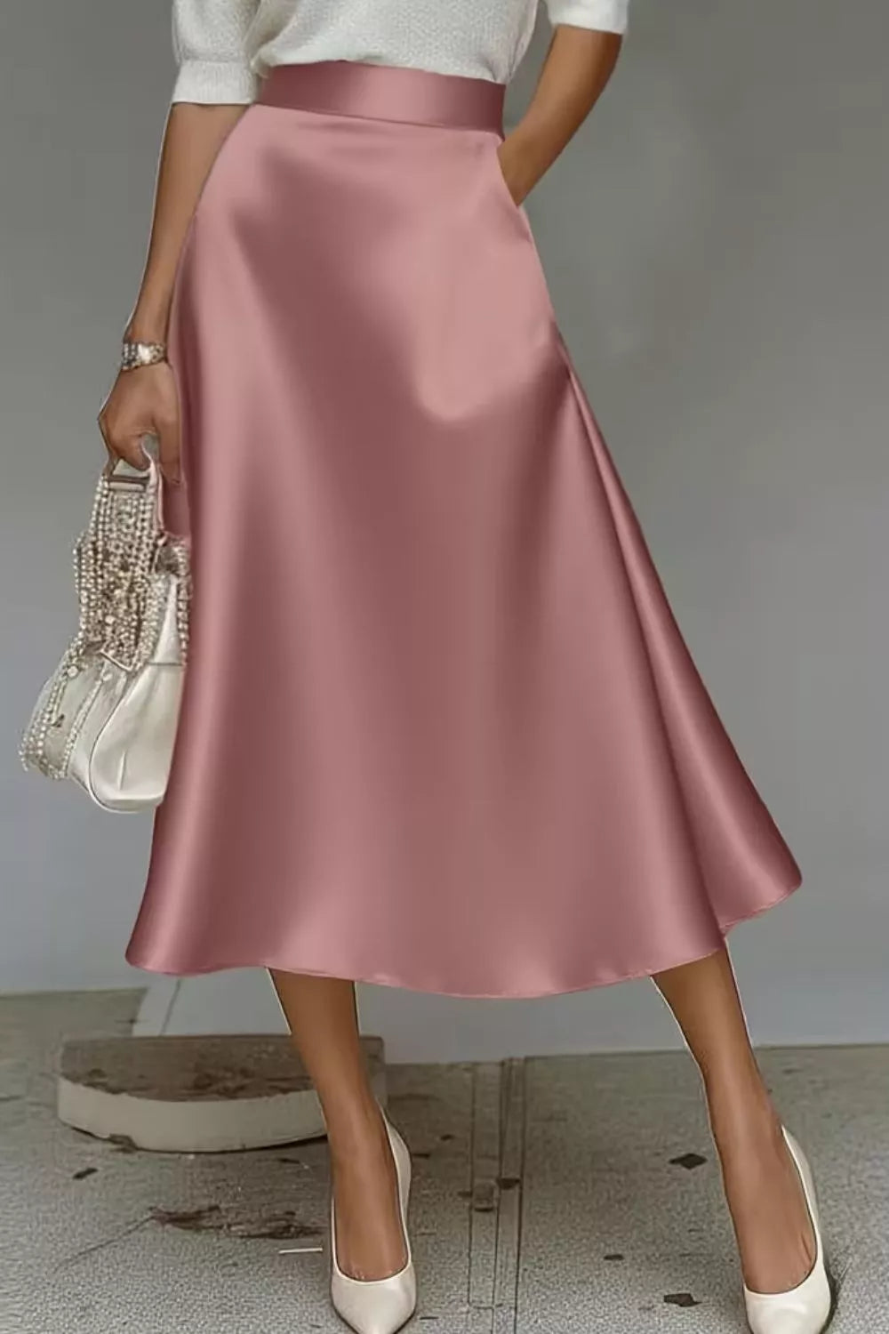 Satin A-line midi skirt in dusty pink with full swing and side pockets