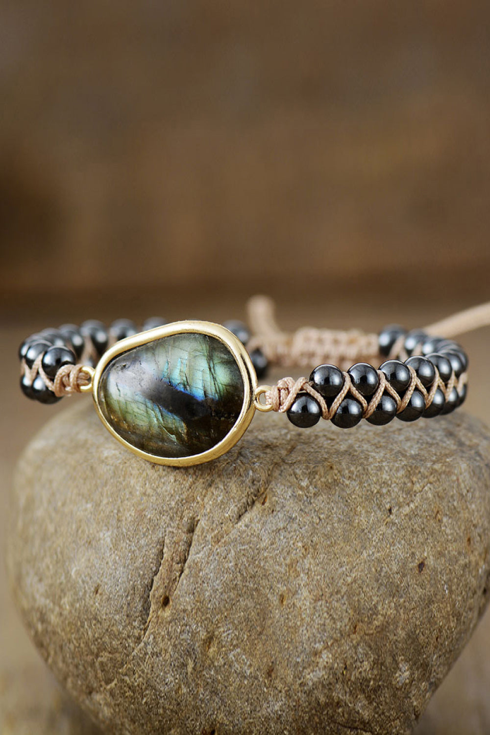 Black beaded bracelet with round labradorite stone in gold-tone bezel and braided details