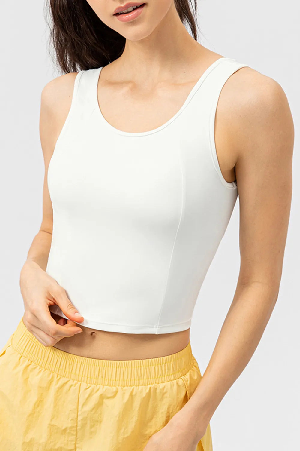 White active tank top with wide straps and round neckline