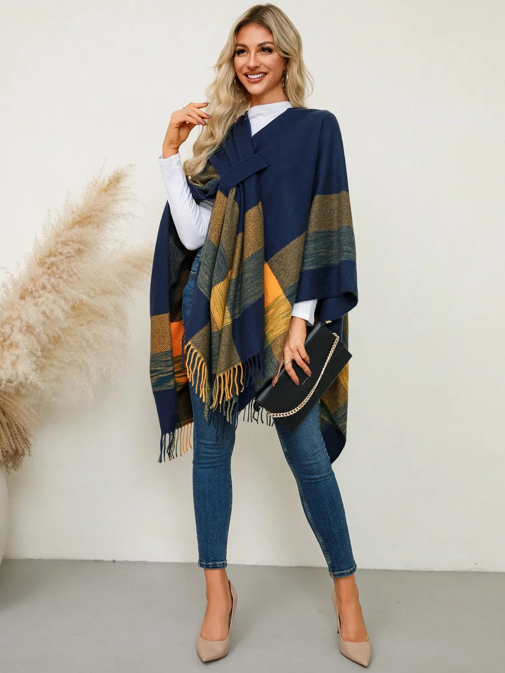 Fringe plaid poncho in navy with olive and gold plaid blocks and tassel trim