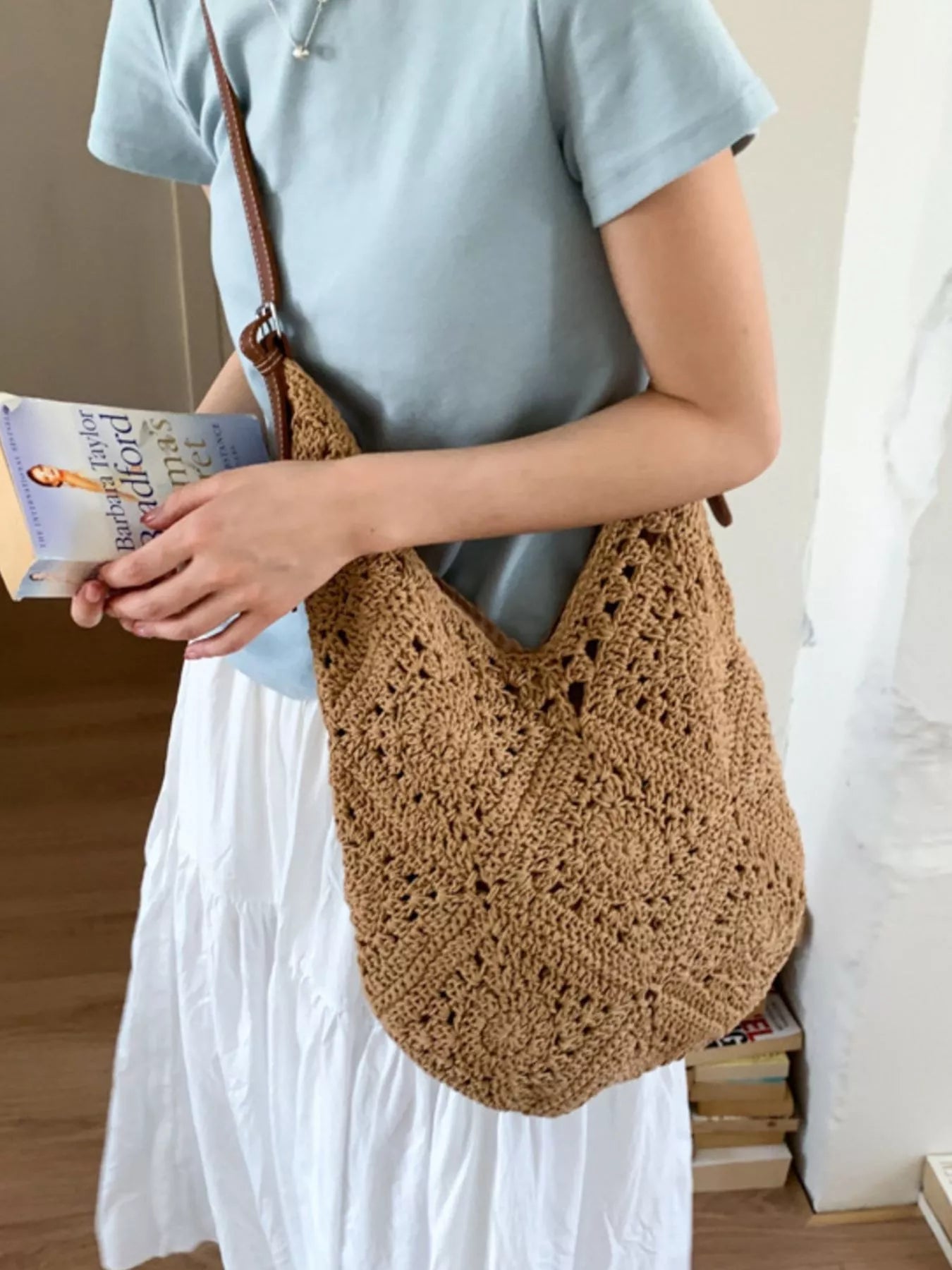 Camel crochet tote-style shoulder bag with brown leather straps and openwork weave