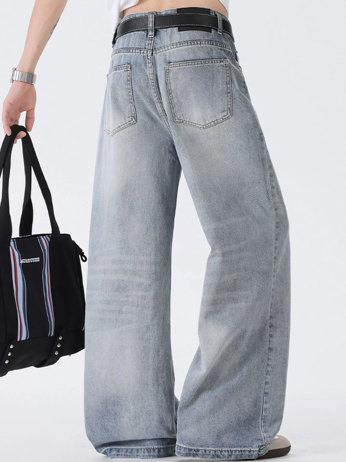 Washed wide-leg denim jeans back view with belt loops and large patch pockets