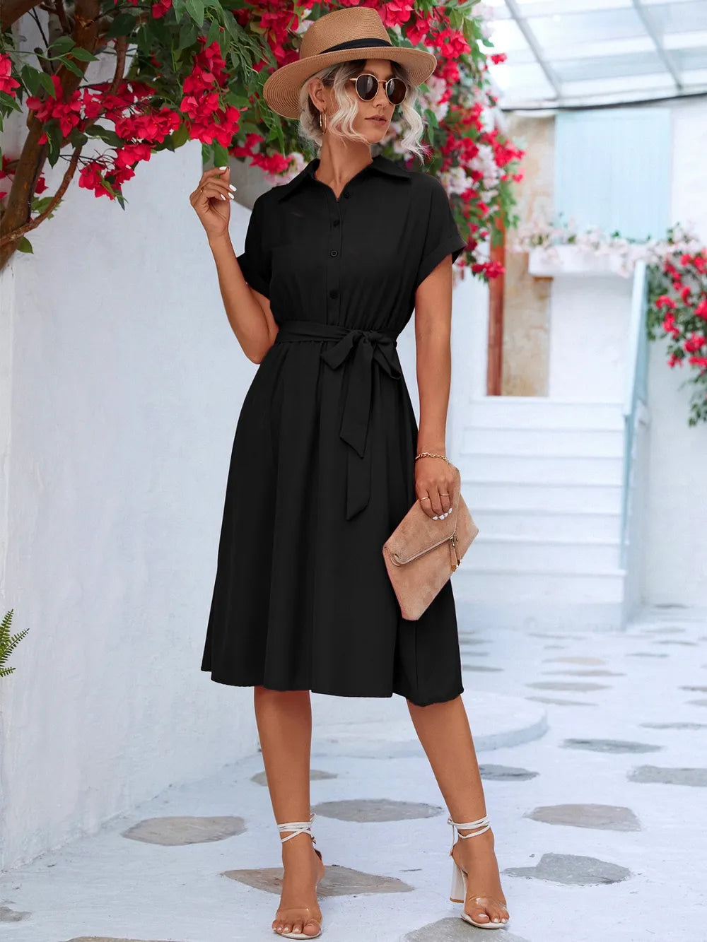 Black button-front tie-waist short sleeve dress with gathered waist and midi skirt