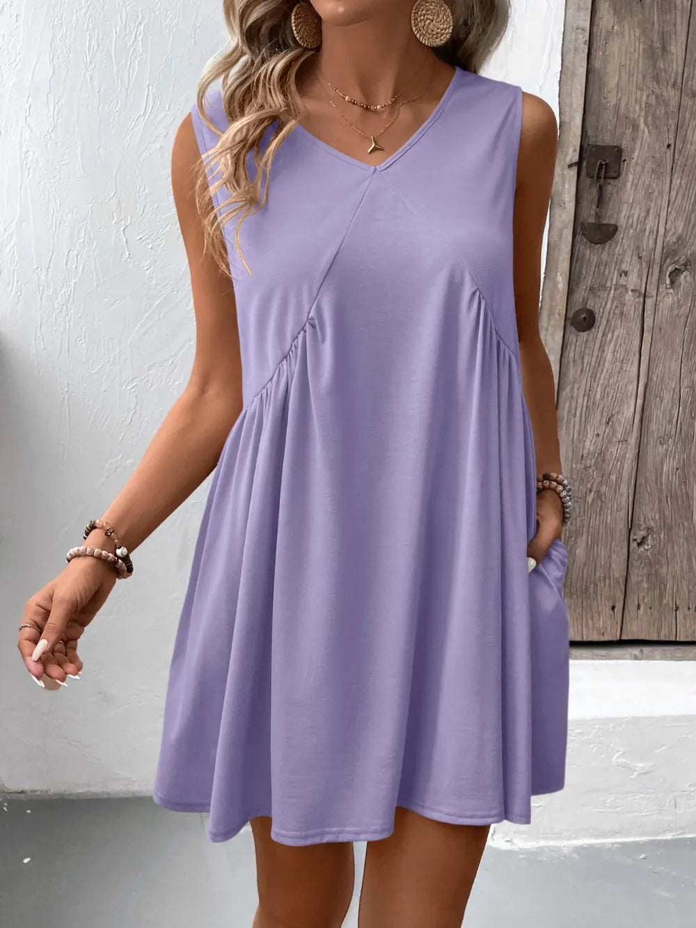 Ivy Lane Ruched V-Neck Sleeveless Mini Dress in lavender, A-line silhouette.