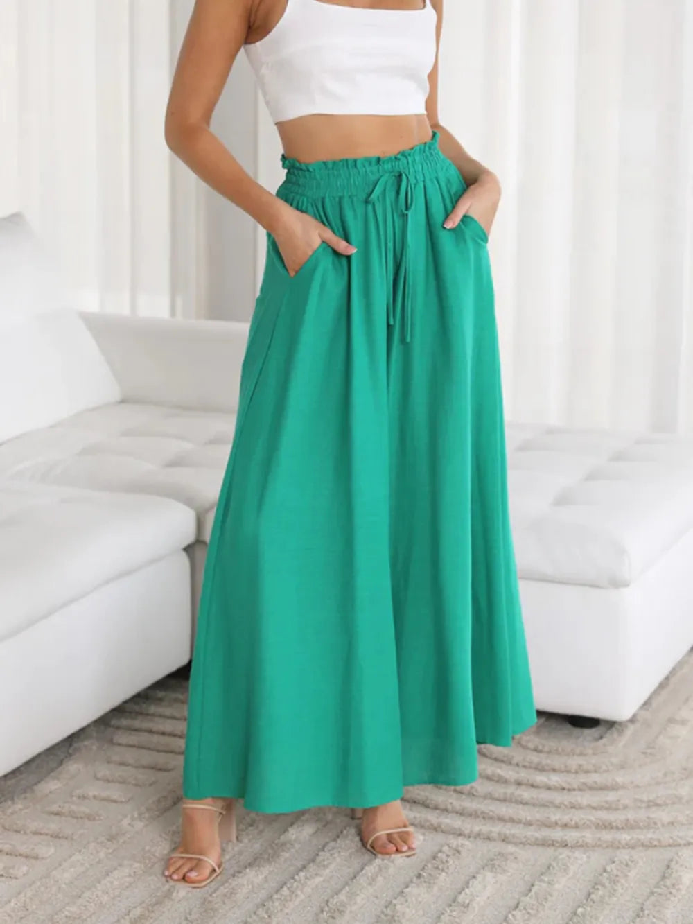 Matcha green wide-leg pants with elastic drawstring waist and side pockets detail