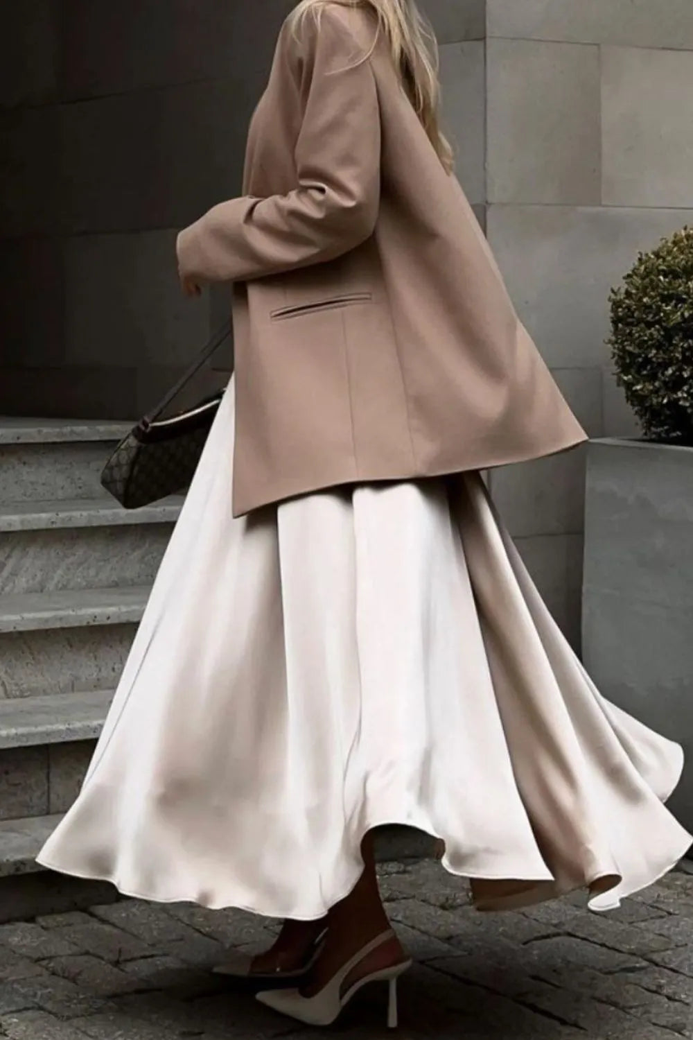 Cream satin midi skirt with elastic back waist, flowing drape and wide hem