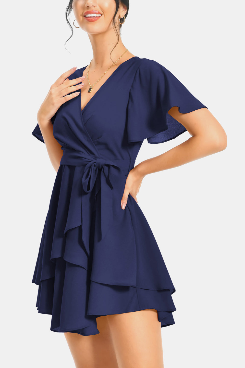 Navy surplice neck flutter sleeve dress with waist tie and tiered ruffle hem